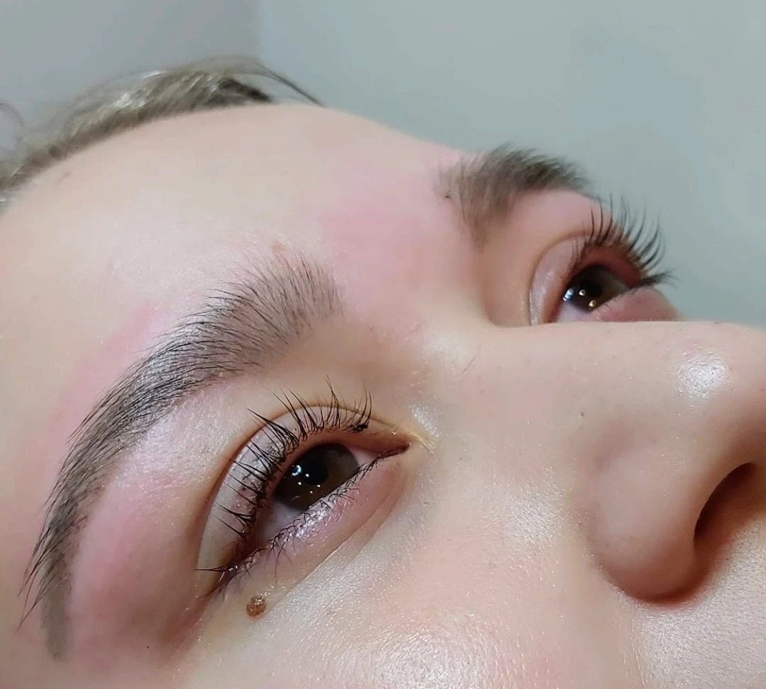 Lifted and tinted lash result, eyes open, angled close-up